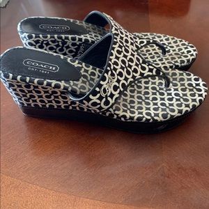 Gently used black and white coach sandals